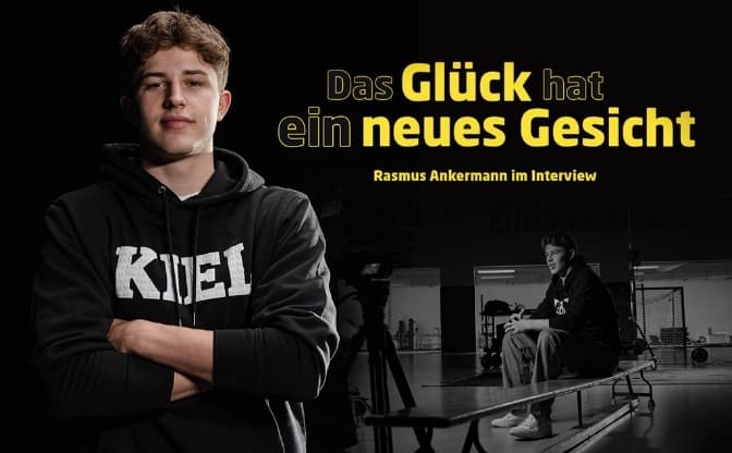 Der THW-Profi Rasmus Ankermann steht mit einem Kiel-Pullover vor einem schwarzen Hintergrund und ist das neue Gesicht des Glücks.